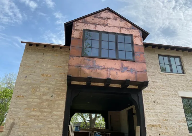 Copper metal panel facade on a stone building for Metal Roof Coating in Mooresville